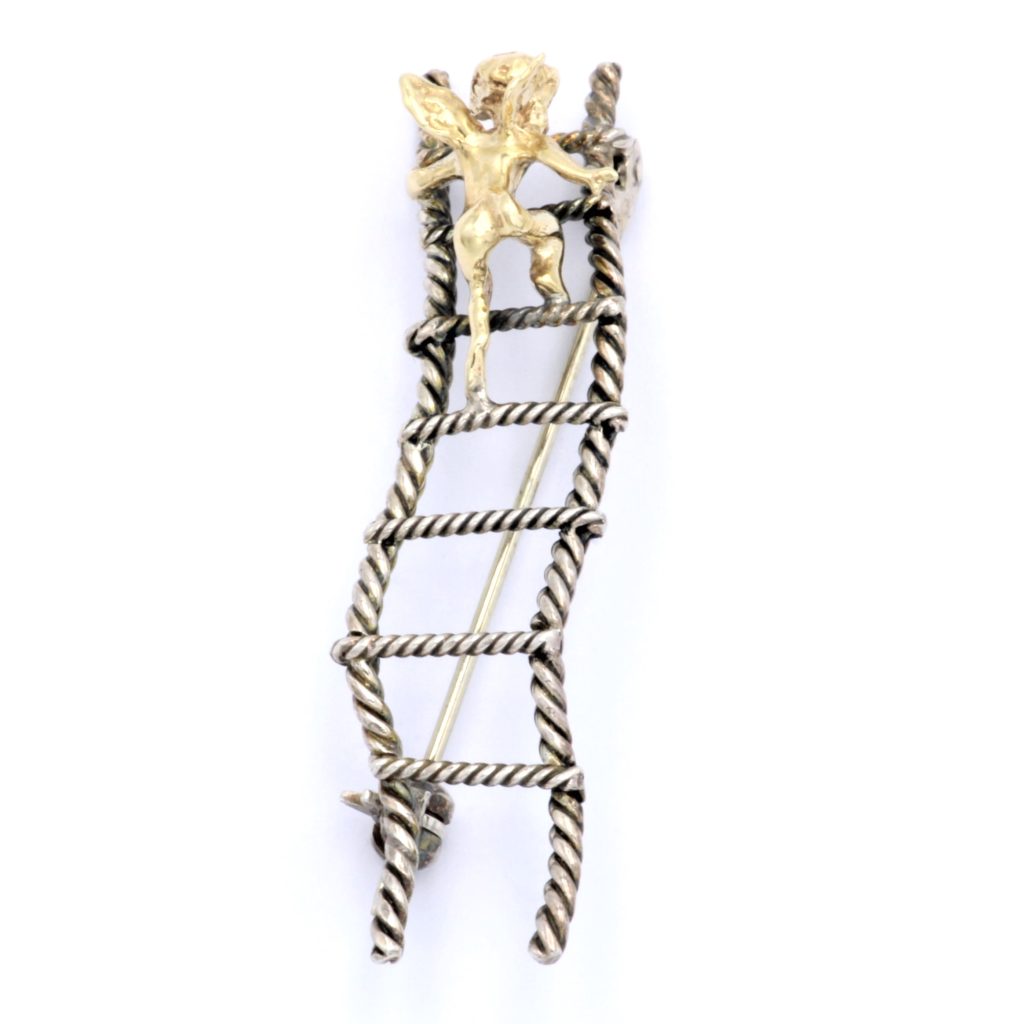 “Cupid on a ladder” Brooch silver and gold