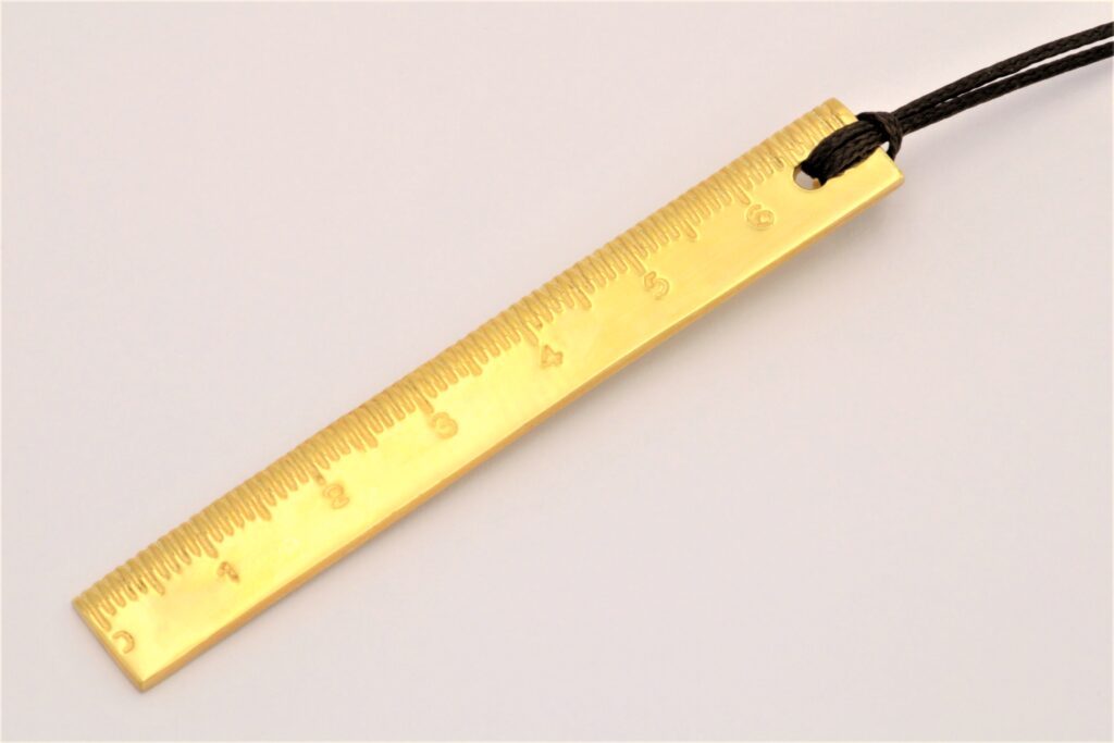 “Ruler rules ok?” Pendant silver yellow