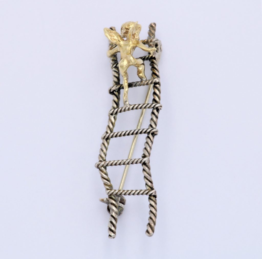 “Cupid on a ladder” Brooch silver and gold